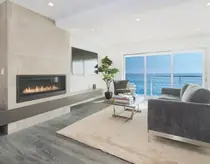 Ocean-view living room with fireplace