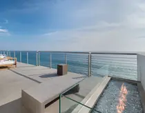 Oceanfront deck with outdoor fire feature
